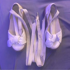 White sandel with laces to tie around your leg